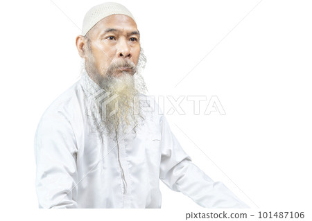 Muslim man with a beard wearing a white cap 101487106