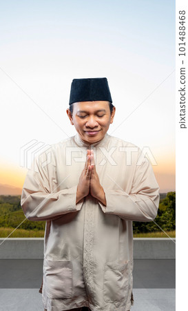 Asian Muslim man with greeting gesture 101488468