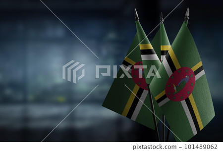 Small flags of the Dominica on an abstract blurry background Small flags of the Dominica on an abstract blurry background 101489062