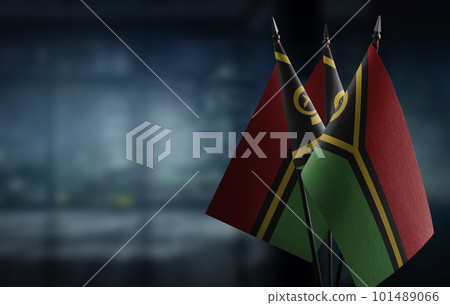 Small flags of the Vanuatu on an abstract blurry background 101489066