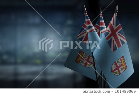 Small flags of the Fiji on an abstract blurry background 101489069