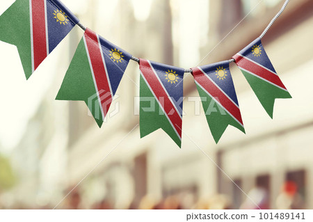 A garland of Namibia national flags on an abstract blurred background 101489141