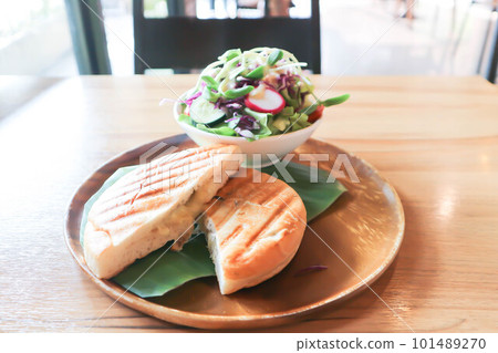 panini, italian sandwich and salad or ham and cheese sandwich 101489270