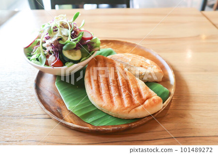 panini, italian sandwich and salad or ham and cheese sandwich 101489272