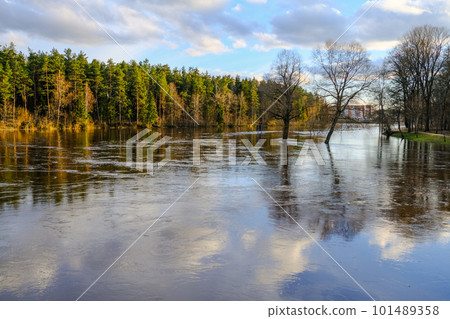 Early spring in Valmiera. Gauja river flooded. Nature in Europe early spring. The river has overflowed its banks. 101489358