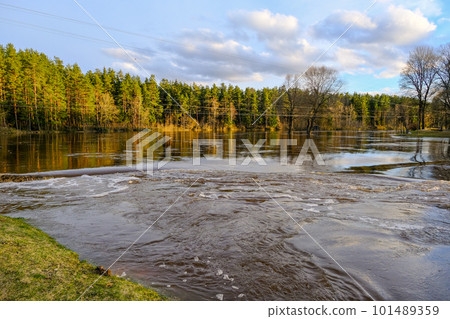Early spring in Valmiera. Gauja river flooded. Nature in Europe early spring. The river has overflowed its banks. 101489359