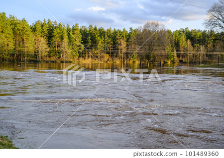 Early spring in Valmiera. Gauja river flooded. Nature in Europe early spring. The river has overflowed its banks. 101489360
