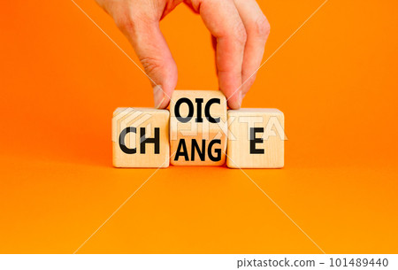 Choice and change symbol. Concept word Choice Change on wooden cubes. Businessman hand. Beautiful orange table orange background. Business and choice and change concept. Copy space. 101489440