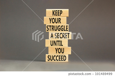 Keep secret symbol. Concept words Keep your struggle a secret until you succeed on wooden blocks. Beautiful grey table grey background. Copy space. Motivational business keep secret concept. 101489499