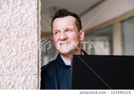 A confident business person with a laptop in the city. Business vision, communications, online shopping A confident business person with a laptop in the city. Business vision, communications, online shopping 101490228