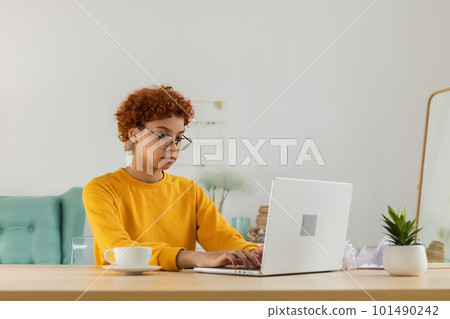 African american girl using laptop at home office looking at screen typing chatting reading writing email. Young woman having virtual meeting online chat video call conference. Work learning from home 101490242