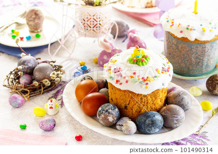 Festive Easter table with colored eggs, Orthodox bread and cottage cheese Easter. Festive Easter table with colored eggs, Orthodox bread and cottage cheese Easter. 101490314