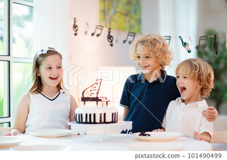 Music and piano birthday party. Kid with cake. 101490499