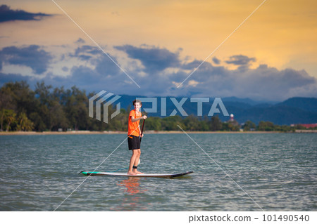Man on stand up paddle. Water and beach sport 101490540
