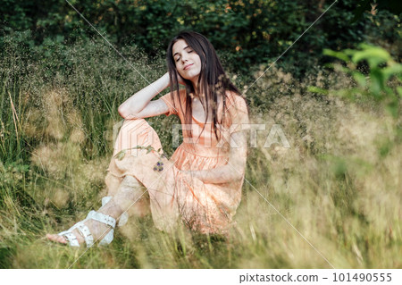 Ways To Unplug From Technology and Be Present. Unplugging from Technology and Living a More Mindful Life. Outdoor portrait of young woman enjoying nature Ways To Unplug From Technology and Be Present. Unplugging from Technology and Living a More Mindful Life. Outdoor portrait of young woman enjoying nature 101490555