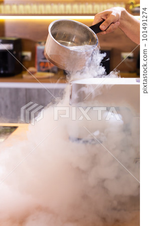 Smoke vapor dry ice in bowl in kitchen Smoke vapor dry ice in bowl in kitchen 101491274