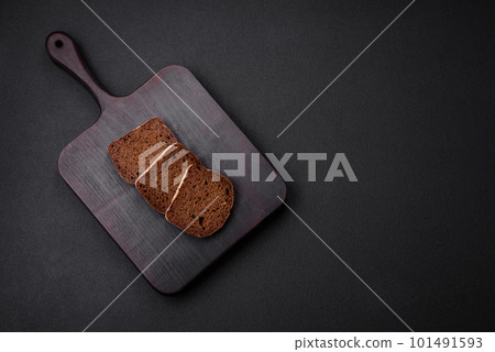 Loaf of fresh crispy brown bread with grains and seeds 101491593