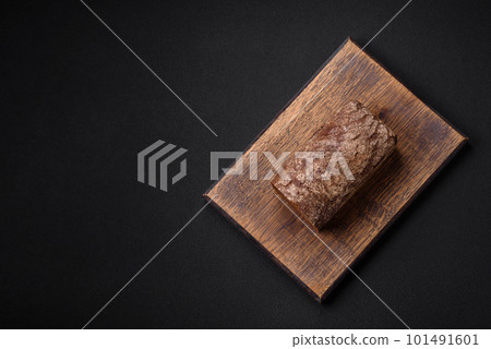 Loaf of fresh crispy brown bread with grains and seeds 101491601