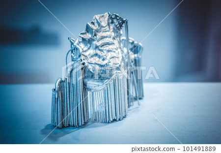 Object printed on metal 3d printer. Dental crowns printed in laser sintering machine. Modern 3D printer printing from metal powder. Concept progressive additive DMLS, SLM, SLS 3d printing technology. 101491889