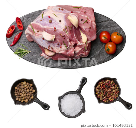 A piece of pork ham on a black board and spices pepper, salt. View from above A piece of pork ham on a black board and spices pepper, salt. View from above 101493151