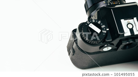 Close up of vintage film camera dial iso selector on white background 101495055