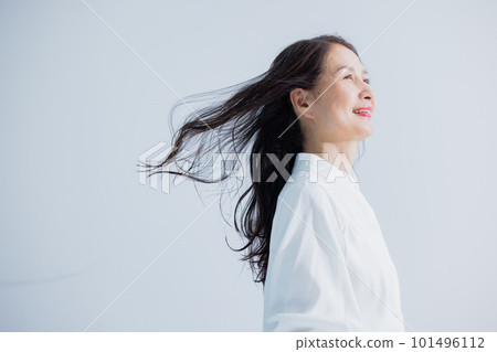 A middle-aged woman with flowing hair A middle-aged woman with flowing hair 101496112