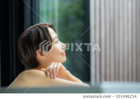 A woman relaxing in the bath 101496254