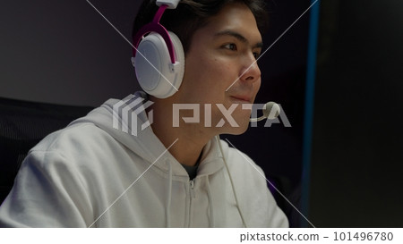 Game streamer using pc setup playing multiplayer first person shooter 101496780