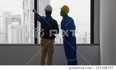 Professional construction workers using tablet brainstorming and planing Professional construction workers using tablet brainstorming and planing 101496797