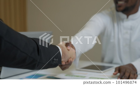 Businessmen shacking hands together showing successful contract agreement Businessmen shacking hands together showing successful contract agreement 101496874