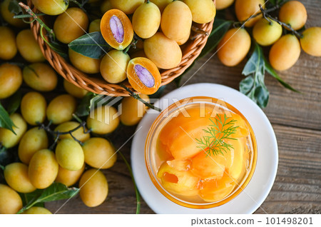 Sweet dessert marian plum fruit  on bowl for food and wooden background, tropical fruit Name in Thailand sweet Yellow Marian Plum Maprang Plango or Mayong chid 101498201