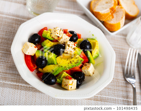 Salad with cheese, black olives and avocado 101498435