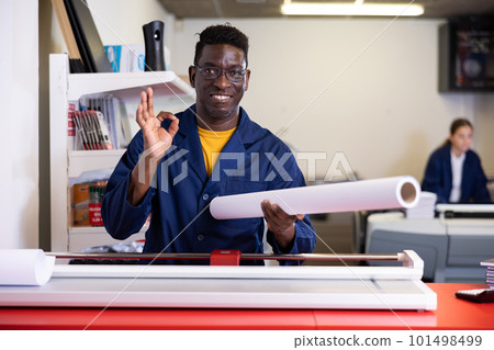 Typography technician offering plotter paper roll Typography technician offering plotter paper roll 101498499