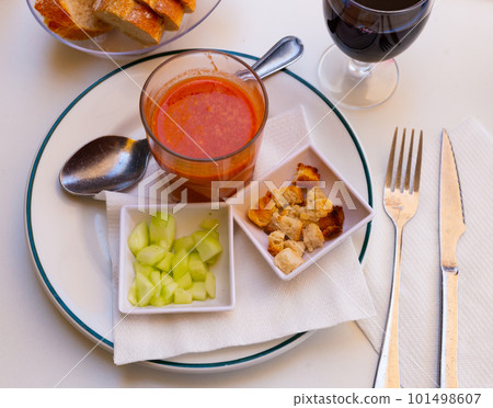 Gazpacho in glass spanish tomato based cold vegetable soup served with cucumbers 101498607