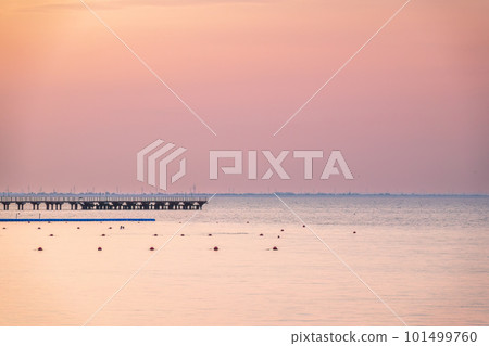 Background of sky and sea, sea is very calm with gentle ripples, sky perfectly clear. 101499760