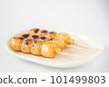 Tasty mitarashi dango on a white plate 101499803