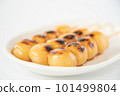 Tasty mitarashi dango on a white plate 101499804