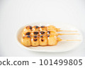 Tasty mitarashi dango on a white plate 101499805