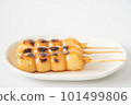 Tasty mitarashi dango on a white plate 101499806