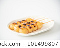 Tasty mitarashi dango on a white plate 101499807