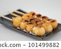 Delicious mitarashi dango on an indigo plate 101499882