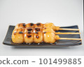 Delicious mitarashi dango on an indigo plate 101499885