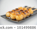Delicious mitarashi dango on an indigo plate 101499886