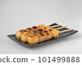 Delicious mitarashi dango on an indigo plate 101499888