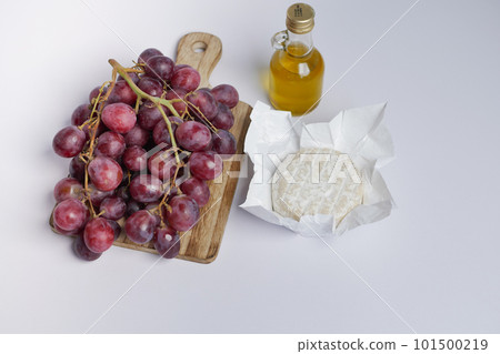fresh goat cheese and grape fruit on wooden background. 101500219