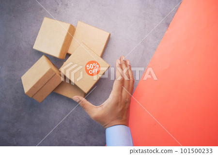 top view of 50 percent discount sign on a box on table  101500233