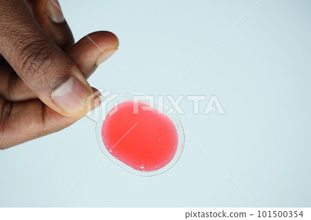 pour liquid medicine on top of spoon pour liquid medicine on top of spoon 101500354
