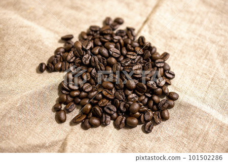 Home-roasted coffee beans on linen cloth Home-roasted coffee beans on linen cloth 101502286