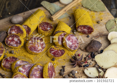 Sliced beef salami with spices and lots of turmeric 101502721