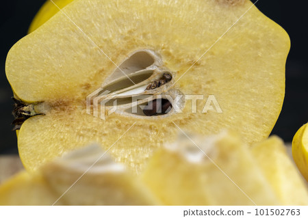 Sliced ripe yellow quince on a cutting board 101502763